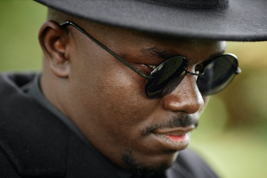 African American man wearing black hat